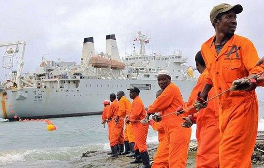 Workers installing the submarine cable.