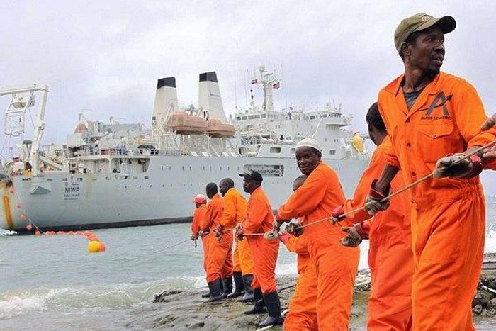 Workers installing the submarine cable.