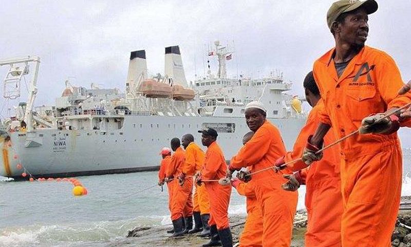 Workers installing the submarine cable.