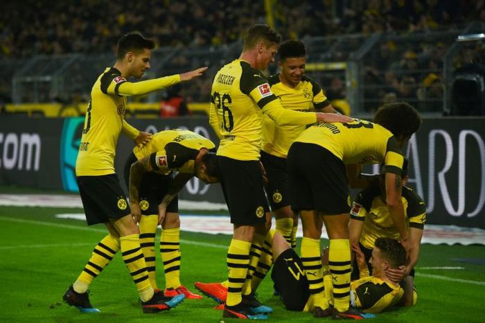 Marco Reus was buried by celebrating team-mates as Dortmund won