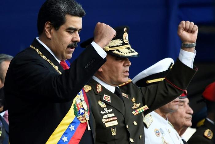 Venezuelan President Nicolas Maduro, seen here with Defense Minister Vladimir Padrino, still has the military's backing