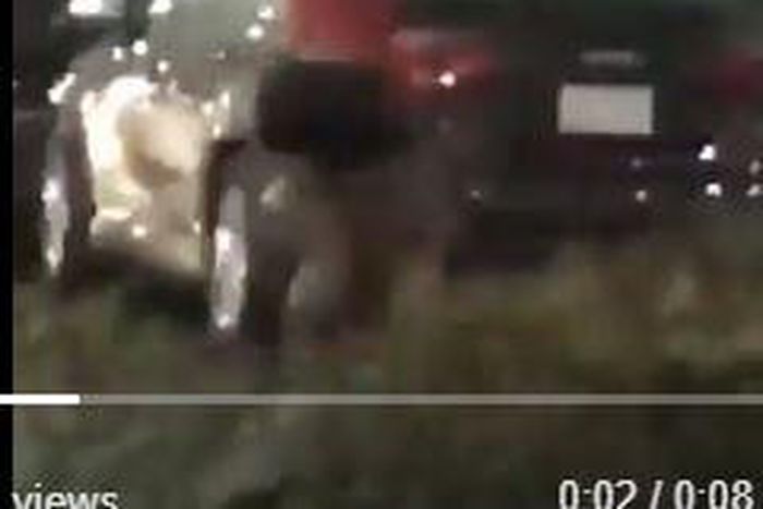 Woman uses her baby as umbrella to protect her Brazilian hair from rain (Video)