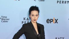 Katy Perry in a tuxedo dress from Baleciaga Pre-Fall 2015 collection over lace-up boots from Giambattista Valli’s fall 2015 collection.
