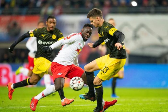 Borussia Dortmund midfielder Julian Weigl (R) thwarts RB Leipzig's French forward Jean-Kevin Augustin (C) during an outstanding display from the Germany international, who played out of position at centre-back, in last Saturday's 1-0 away win.