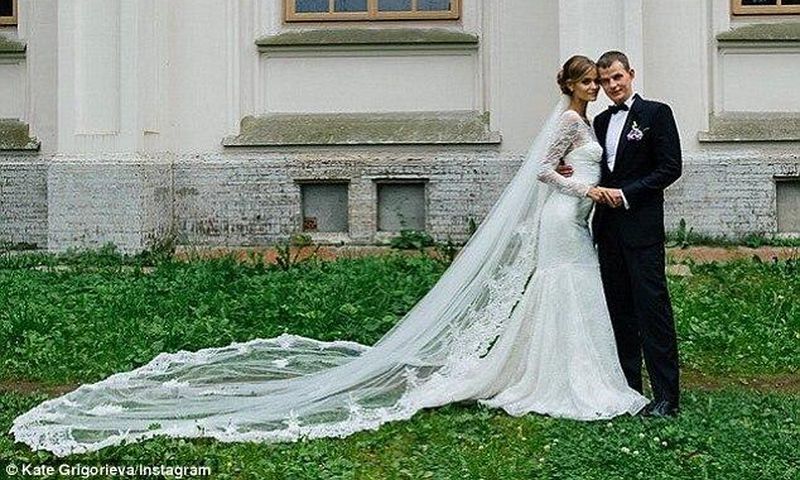 Model Kate Grigorieva couldn't have looked more angelic as she wore white for her wedding in Russia on Sunday to her soldier husband Alexander 