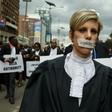 Silenced by injustice: one lawyer marched in silence with a piece of masking tape over her mouth