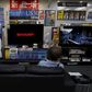 A man sitting on a sofa looks at a Sharp Corp's Aquos TV at an electronics retailer in Tokyo