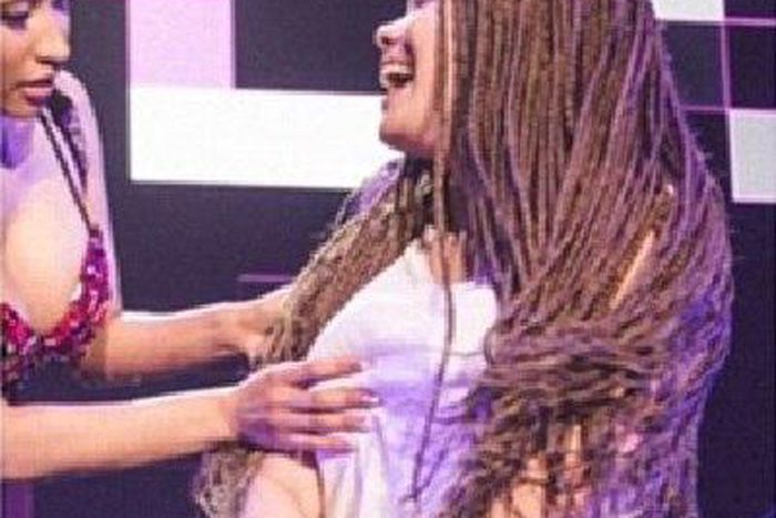 Nicki Minaj grabs a fan's burst during performance in Germany