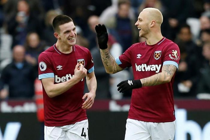 Declan Rice (L) celebrates with West Ham team-mate Marko Arnautovic (R) after scoring the only goal of a 1-0 win at home to London rivals Arsenal in the Premier League on Saturday