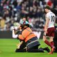 A pitch invader gestures at West Ham United's Angelo Ogbonna (left) during crowd trouble at a Premier League match against Burnley in March