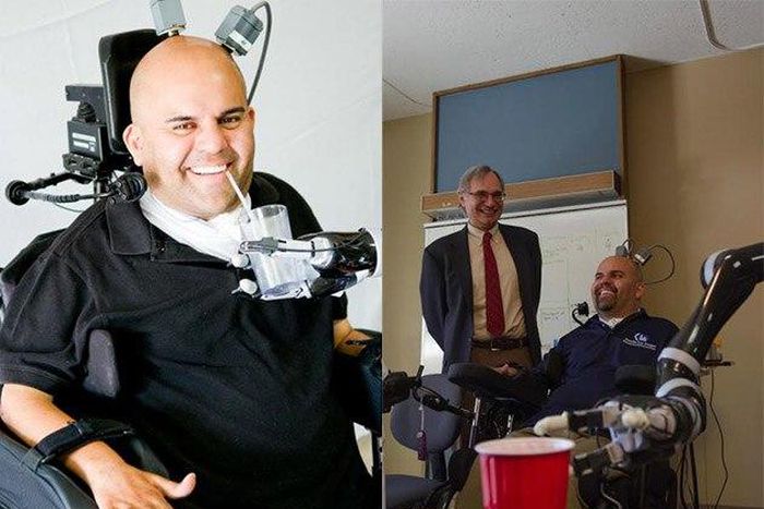 Eric Sorto using the robotic arm to take drinks