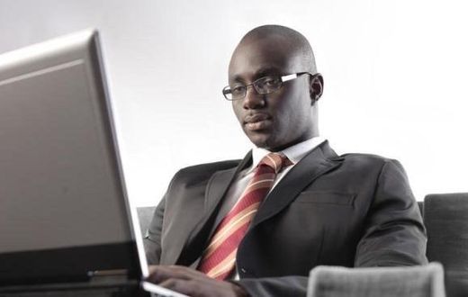 ___3887149___https:______static.pulse.com.gh___webservice___escenic___binary___3887149___2015___6___19___16___black-man-types-on-laptop_t750x550