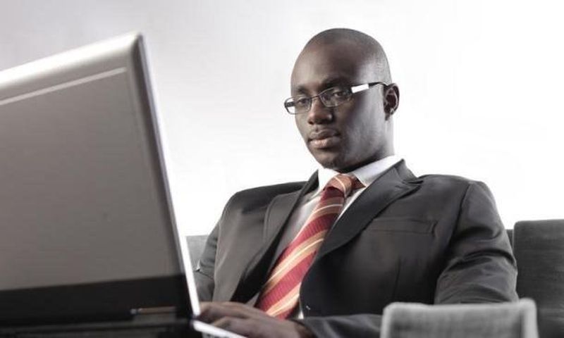 ___3887149___https:______static.pulse.com.gh___webservice___escenic___binary___3887149___2015___6___19___16___black-man-types-on-laptop_t750x550
