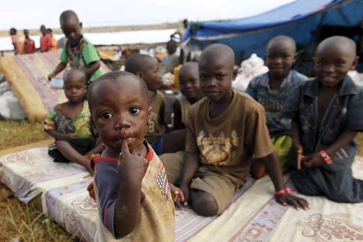 Burundian refugee children pose for a photograph at the Lake Tanganyika stadium in Kigoma western Tanzania, May 19, 2015.  REUTERS/Thomas Mukoya