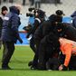 A club at war: Marseille security staff wretsled pitch invaders to the ground at the final whistle