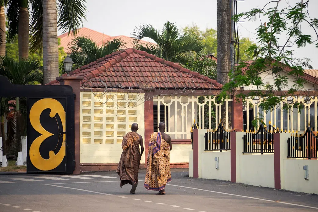 An image of two elders entering the Manhyia Palace