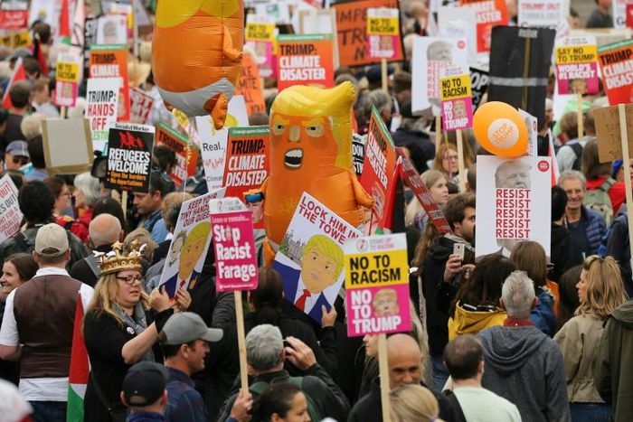 Around 2,500 people gathered under the shadow of Nelson's Column in Trafalgar Square for the "Carnival of Resistance" against the US leader, ahead of his meeting with outgoing British Prime Minister Theresa May at nearby Downing Street.