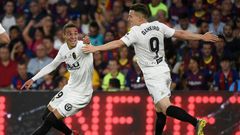 Rodrigo (L) and Kevin Gameiro got the goals as Valencia upset Barcelona in Seville