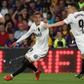 Rodrigo (L) and Kevin Gameiro got the goals as Valencia upset Barcelona in Seville