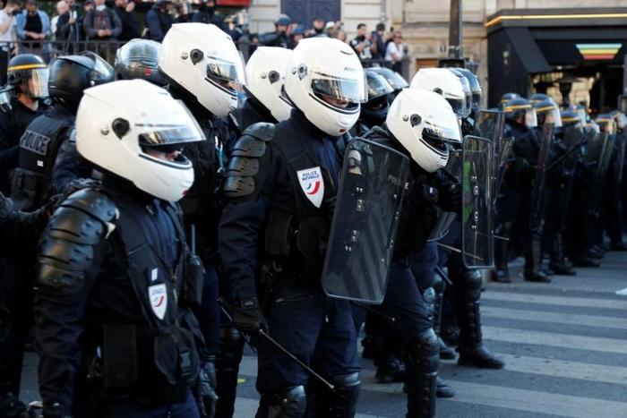 Politicians and police unions have angrily condemned some protesters who chanted "commit suicide!" at officers