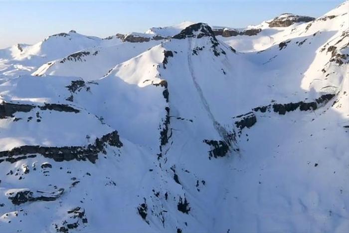Rescue operations went on after dark with police fearing people could still be trapped under the snow after an avalanche hit the Swiss ski resort of Crans-Montana