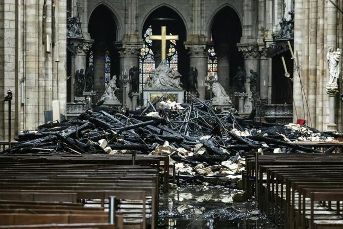 The altar surrounded by charred debris inside the Notre-Dame Cathedral in Paris after a fire that devastated the cathedral