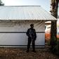 A police officer guarding an Ebola Treatment Centre in Butembo, the epicentre of DR Congo's latest Ebola outbreak