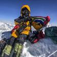 Saray Khumalo poses with a South African flag on May 16, 2019, after becoming the first black African woman to climb Mount Everest