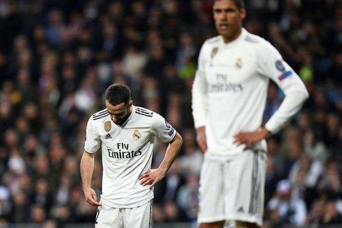 A dejected Dani Carvajal (L) comes to terms with Real Madrid's humiliating Champions League exit