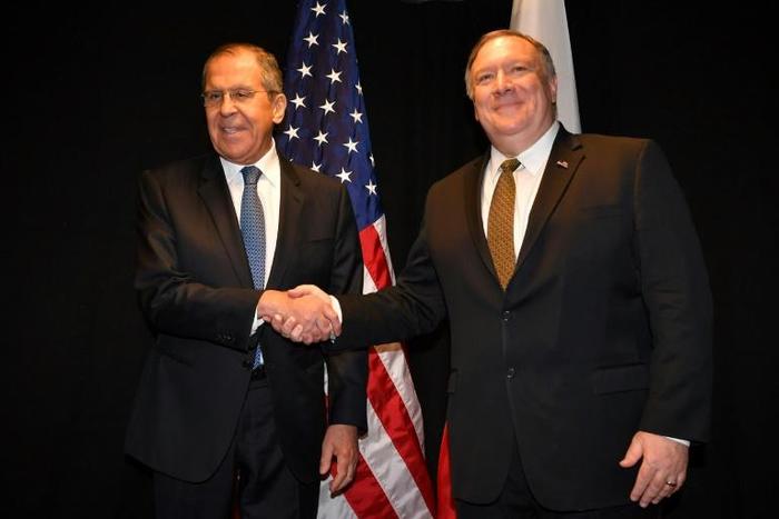 US Secretary of State Mike Pompeo and Russian Foreign Minister Sergei Lavrov pose for the press as they meet on the sidelines of an Arctic Council meeting in Rovaniemi, Finland