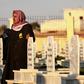 A man in the northern Syrian town of Kobane walks in a graveyard during the funeral of a fighter of the Syrian Democratic Forces killed in an offensive by the Islamic State movement