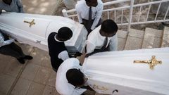 Eighty-one white coffins containing the remains of 84,437 victims of the 1994 mass killings were buried at the Nyanza Genocide Memorial in Kigali