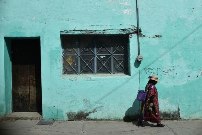 An indigenous woman walks in Tlaxiaco, in the southern Mexican state of Oaxaca, the modest hometown of Yalitza Aparicio, who has been nominated for a best actress Oscar for her performance in Alfonso Cuaron's "Roma"