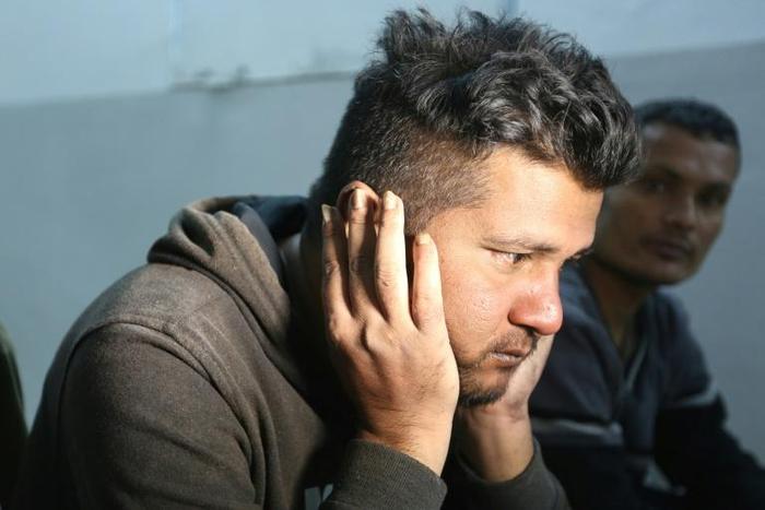 Ahmed Bilal, a Bangladeshi who survived a migrant shipwreck that killed dozens, rests at a shelter in the Tunisian coastal city of Zarzis on Saturday