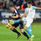 Bordeaux's French forward Nicolas De Preville (L) fights for the ball with Marseille's French midfielder Maxime Lopez during the French L1 football match