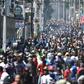 Demonstrators march on the streets of Port-au-Prince against Haitian President Jovenel Moise and the misuse of development funds on February 11, 2019
