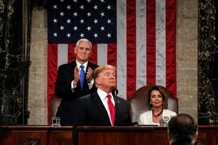 US President Donald Trump delivers the State of the Union address, alongside Vice President Mike Pence and Speaker of the House Nancy Pelosi, at the US Capitol in Washington, DC, on February 5, 2019