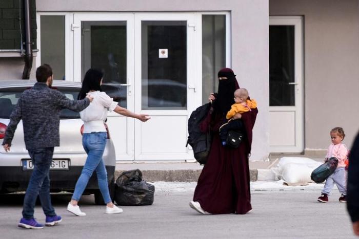 The 26 women placed under house arrest are among a group of around 30 flown back to Pristina alongside 74 children and four men