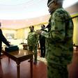 Sudanese President Omar al-Bashir swears in Mohamed Tahir Eila as the country's new prime minister