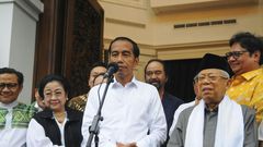 Indonesia's Joko Widodo (C), who has won a second term as president, spoke to reporters with his running mate Ma'ruf Amin (R) in Jakarta three days before the official results were announced