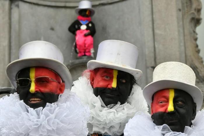 The Noirauds hope that, with red and yellow stripes alongside the traditional black, their costume will no longer attract comparison to racist "blackface" caricatures
