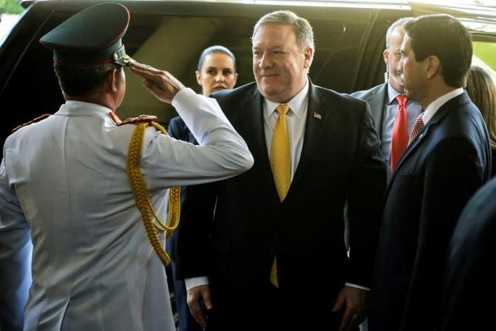 U.S. Secretary of State Mike Pompeo is welcomed by Paraguay's Military Cabinet Chief General Roque Alberto Sotelo (L) and Ambassador Federico Gonzalez (R) at the presidential palace in Asuncion