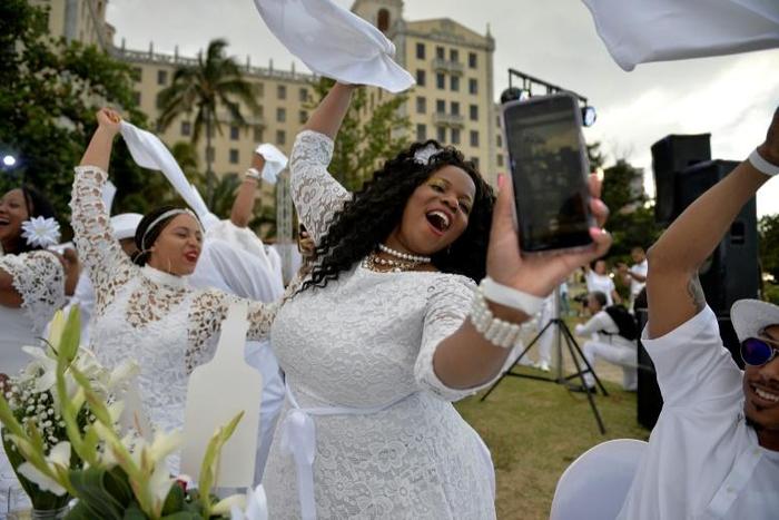 Invitees enjoying a Dinner in White at Havana's National Hotel on April 6, 2019