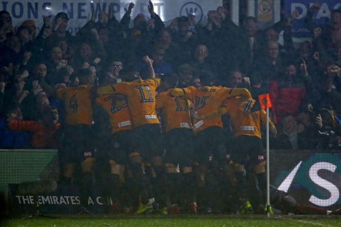 Newport County players celebrate a 2-0 win over Middlesbrough to set up a fifth round meeting with Manchester City