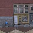 Built into a building's air vent at pavement level, the two little pastel-coloured storefronts are the altest installation from the artist's collective Anonymouse