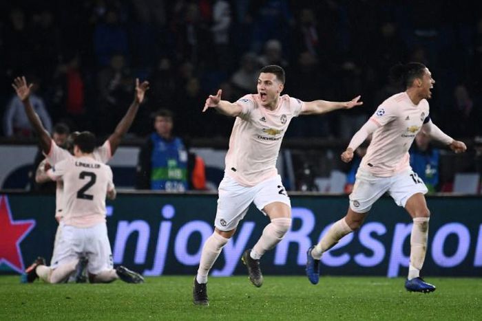Manchester United's Chris Smalling and Diogo Dalot lead the celebrations after their incredible win over PSG