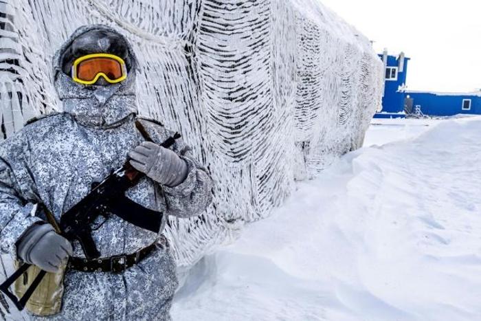 A guard at the Russian military base on Kotelny island, beyond the Artic circle, illustrates Russia's interest in the strategic region