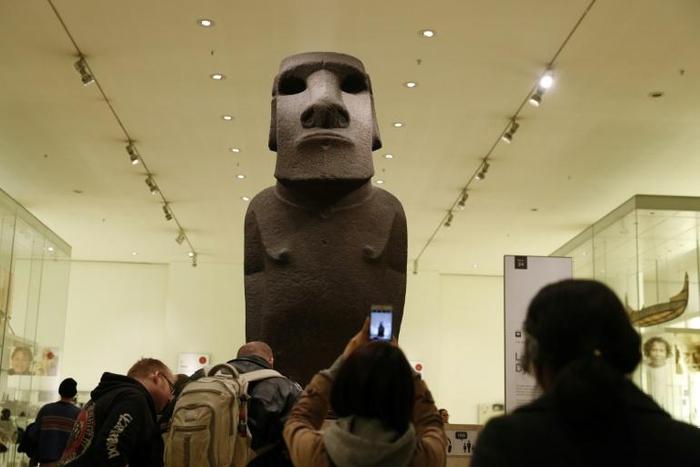 A sacred statue known as Hoa Hakananai'a stands at the entrance to a gallery in the British Museum in London