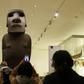 A sacred statue known as Hoa Hakananai'a stands at the entrance to a gallery in the British Museum in London