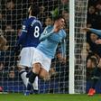 Manchester City's Aymeric Laporte celebrates scoring the opening goal at Everton